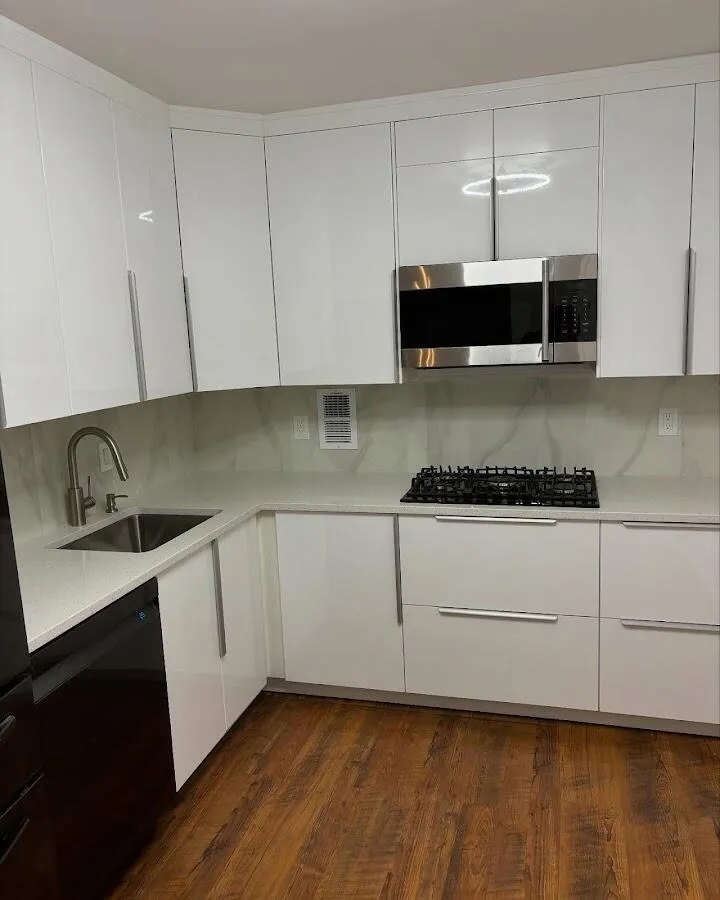 Restored kitchen with white cabinets after water damage in Lacy-Lakeview